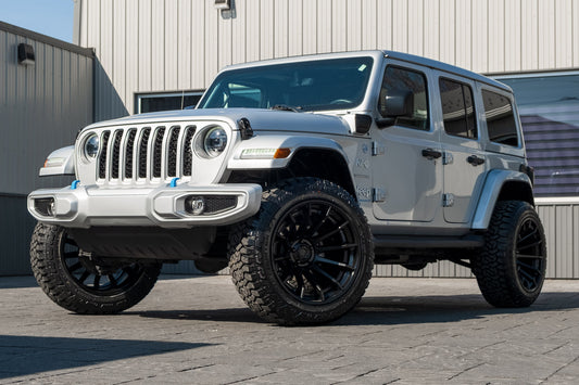 2023 Jeep Wrangler Unlimited Sahara 4XE with a 2.5" Rough Country lift kit, 22x12 Fuel Burn wheels, and 35" Fury Country Hunter R/T tires.