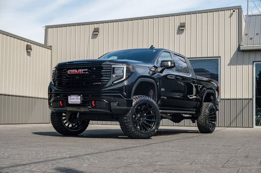 2024 GMC Sierra 1500 AT4 with a 6" Rough Country lift kit, 22x12 Fuel Burn wheels, and 35" Fury Country Hunter R/T tires.