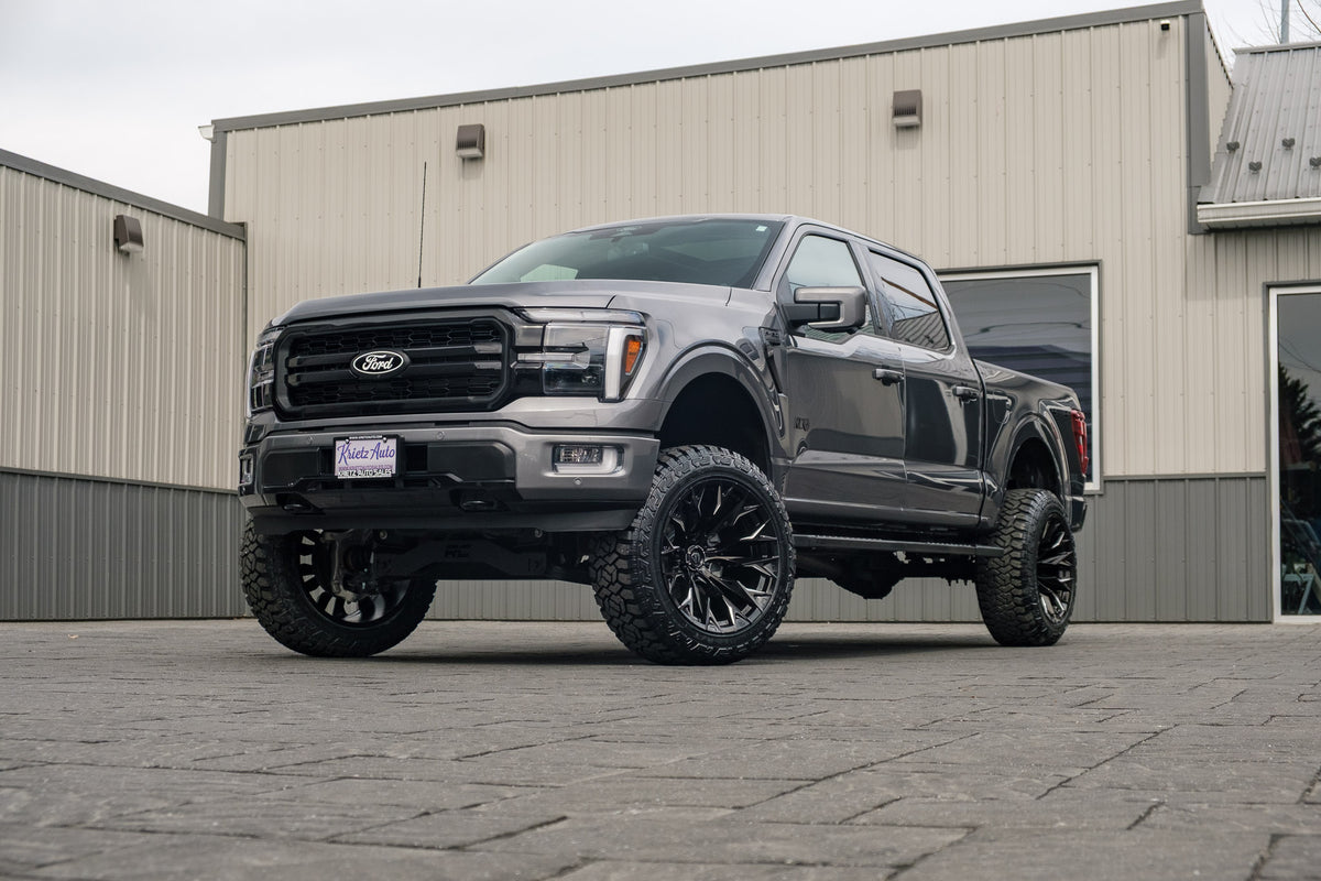 2024 Ford F-150 Lariat with a 6" Rough Country lift kit, 22x12 Fuel Flame wheels, and 35" Fury Country Hunter R/T tires.