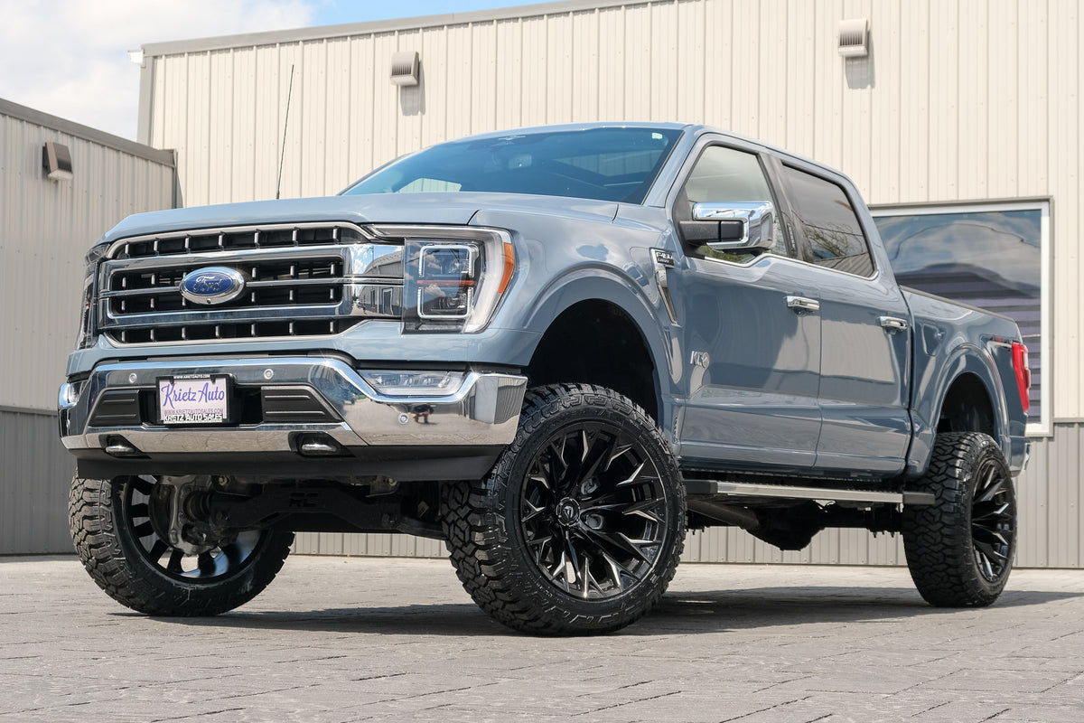 2023 Ford F-150 Lariat with a 6" Rough Country lift kit, 22x12 Fuel Flame wheels, and 35" Fury Country Hunter R/T tires.