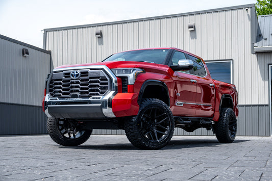 2024 Toyota Tundra Platinum with a 6" Rough Country lift kit, 22x12 Fuel Flux wheels, and 35" Fury Country Hunter R/T tires.