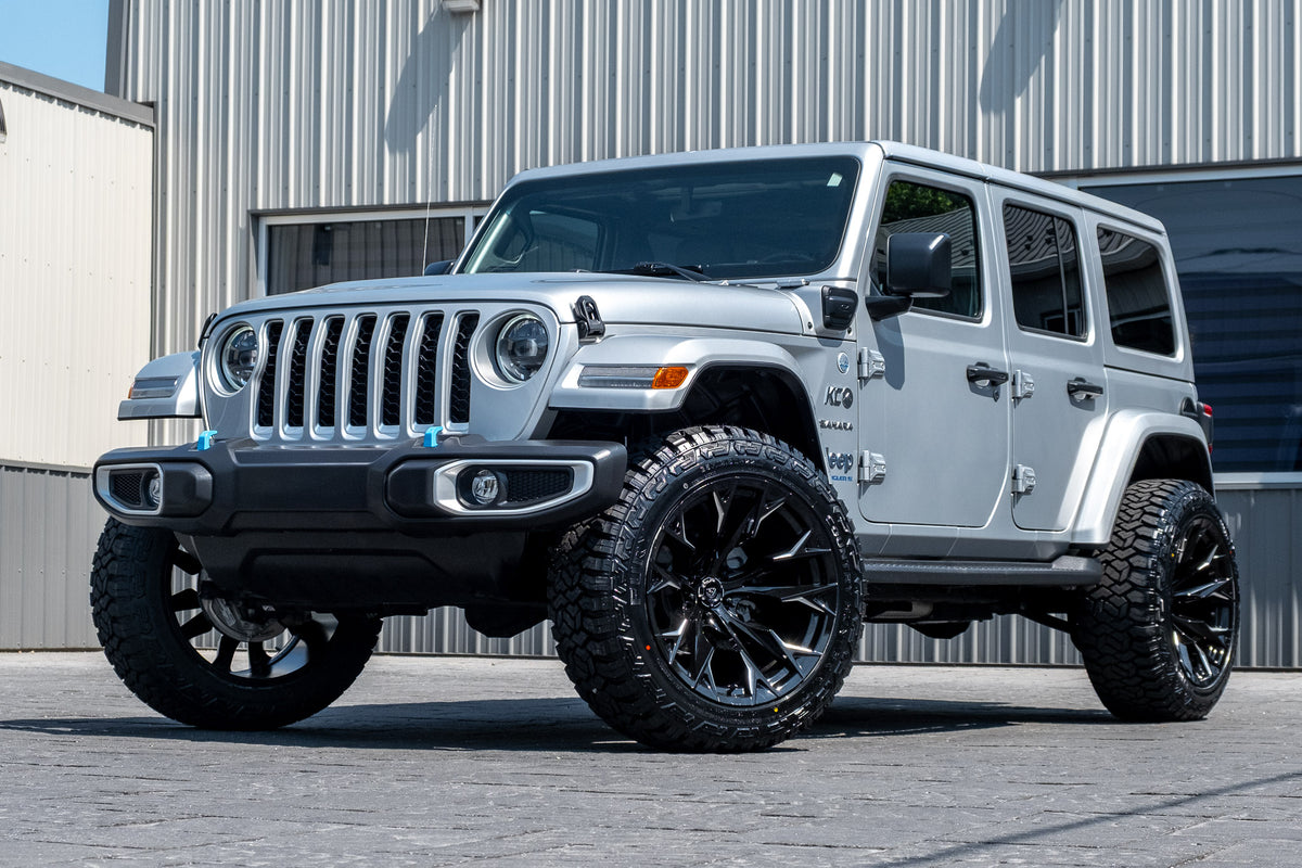 2023 Jeep Wrangler Unlimited Sahara 4XE with a 2.5" Rough Country Lift Kit, 22x12 Fuel Flame wheels, and 35" Fury Country Hunter R/T tires.