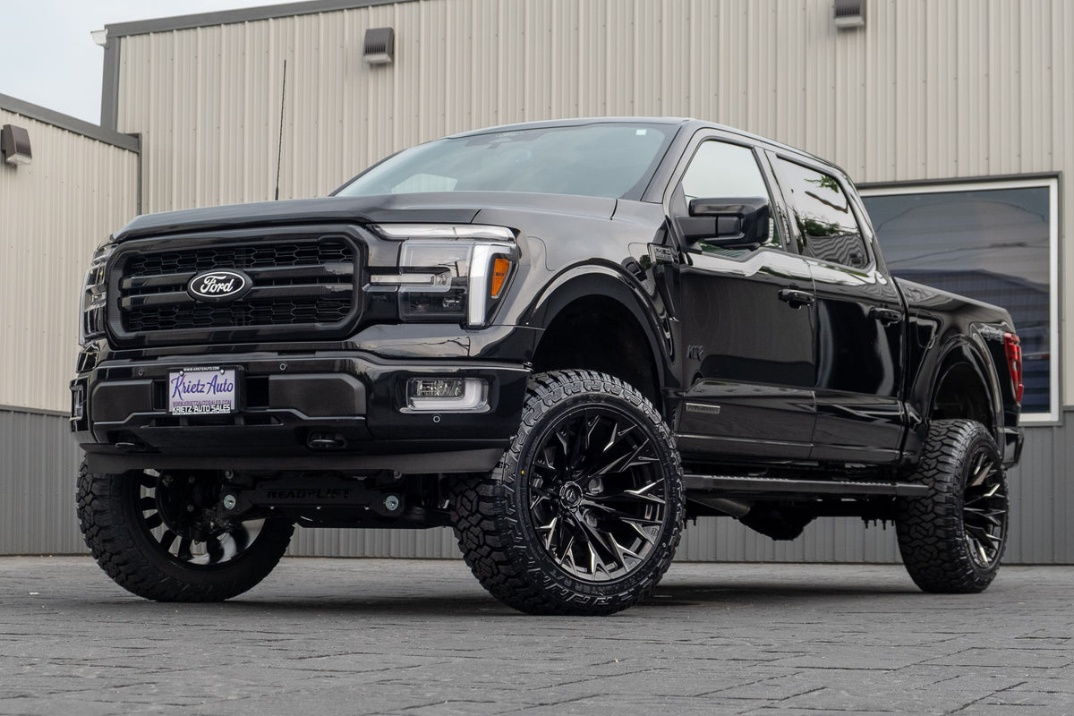 2024 Ford F-150 Lariat with a 6" Readylift lift kit, 22x12 Fuel Flame wheels, and 35" Country Hunter R/T tires.