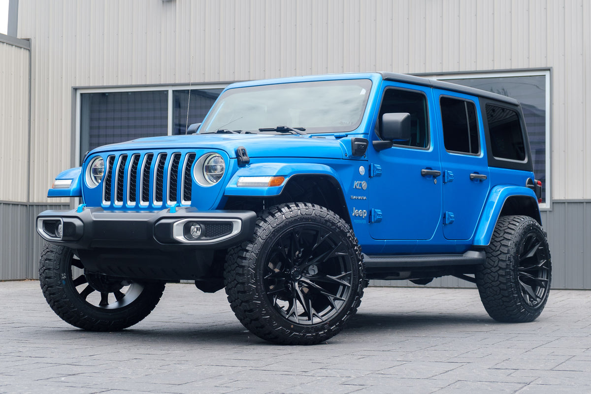 2022 Jeep Wrangler Unlimited Sahara 4XE with a 2.5" Rough Country lift kit, 22x12 Fuel Flame wheels, and 35" Fury Country Hunter tires.