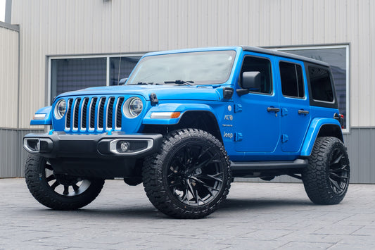 2022 Jeep Wrangler Unlimited Sahara 4XE with a 2.5" Rough Country lift kit, 22x12 Fuel Flame wheels, and 35" Fury Country Hunter tires.