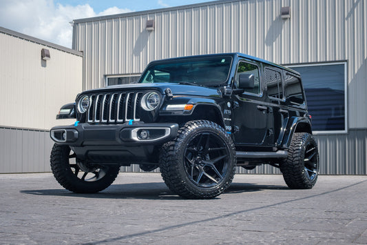 2022 Jeep Wrangler Unlimited Sahara 4XE with a 2.5 Rough Country lift kit, 22x12 Fuel Flux wheels, and 35" Avix Trailtek R/T tires.