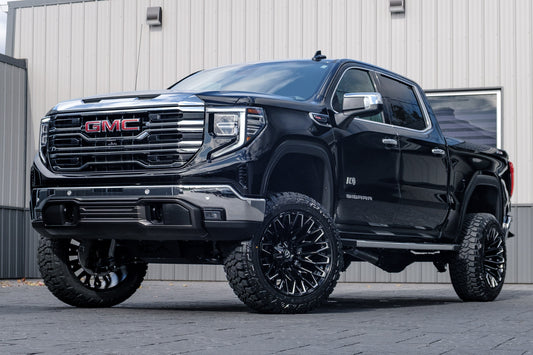 2025 GMC Sierra 1500 SLT with a 6" Rough Country lift kit, 22x12 Fuel Strike wheels, and 35" Fury Country Hunter R/T tires.