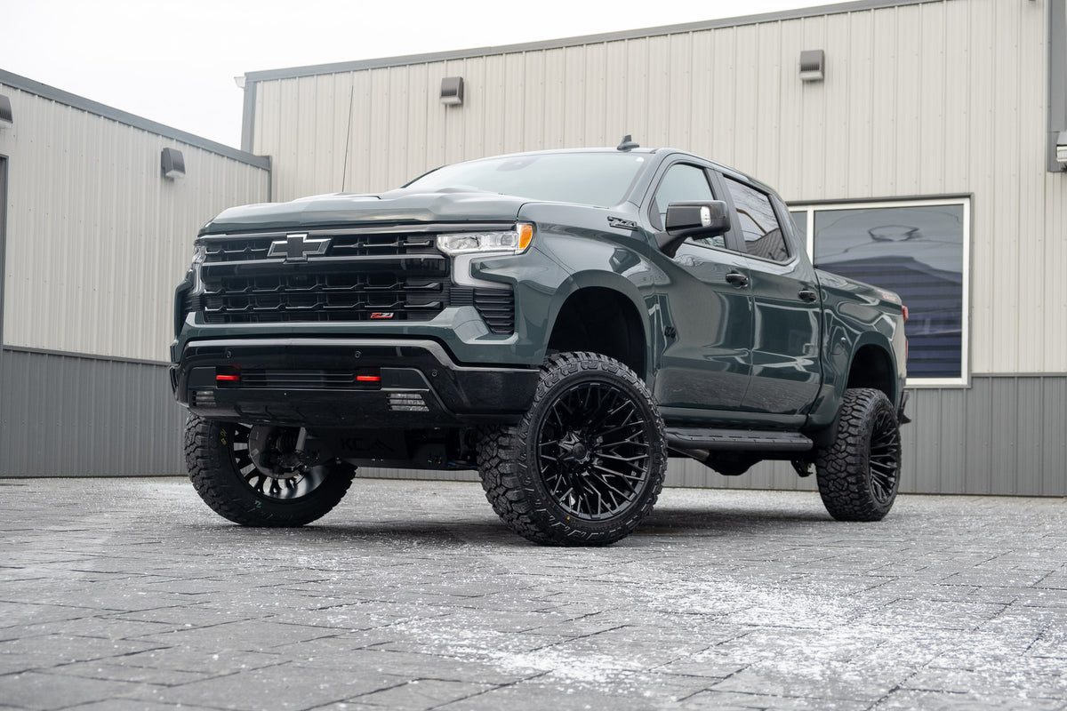 2025 Chevrolet Silverado 1500 LT Trail Boss with a 6" Rough Country lift kit, 22x12 Fuel Strike wheels, and 35" Fury Country Hunter R/T tires.