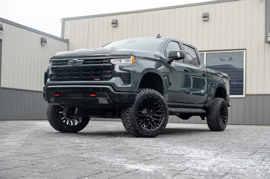 2025 Chevrolet Silverado 1500 LT Trail Boss with a 6" Rough Country lift kit, 22x12 Fuel Strike wheels, and 35" Fury Country Hunter R/T tires.