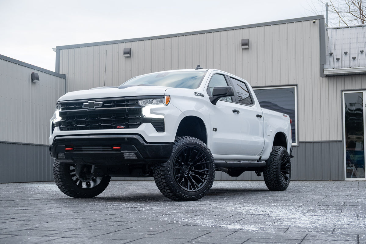 2025 Chevrolet Silverado 1500 LT Trail Boss with a 6" Rough Country lift kit, 22x12 Fuel Rebar wheels, and 35" Fury Country Hunter R/T tires.