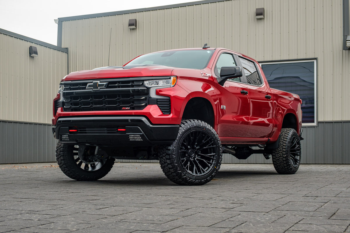 2025 Chevrolet Silverado 1500 LT Trail Boss with a 6" Rough Country lift kit, 22x12 Fuel Rebar wheels, and 35" Fury Country Hunter R/T tires.