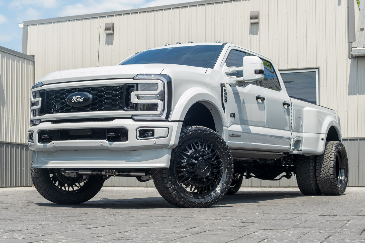 2026 Ford F-450 Super Duty Platinum with a 4" Wicked lift kit, 24x8.25 American Force Plague wheels, and 37" Toyo Open Country R/T Trail tires.