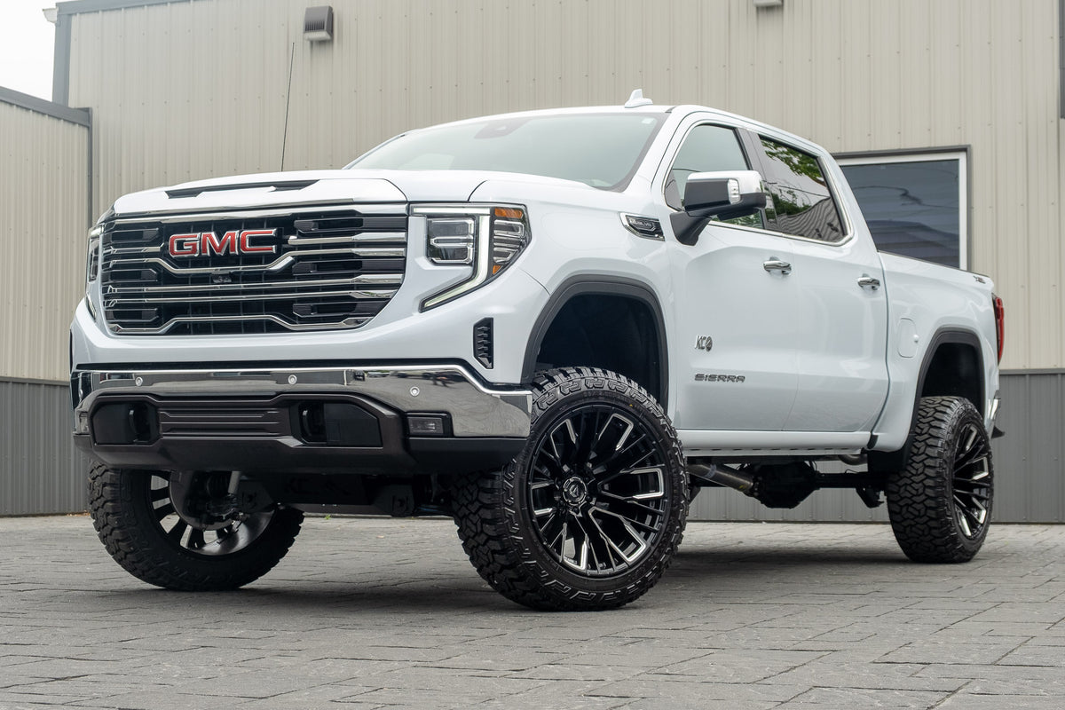 2026 GMC Sierra 1500 SLT with a 6" Rough Country lift kit, 22x12 Fuel Rebar wheels, and 35" Fury Country Hunter R/T tires.
