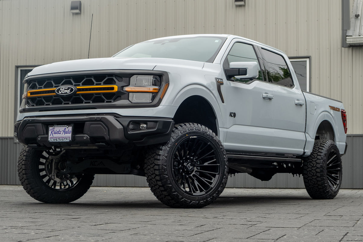 2025 Ford F-150 Tremor with a 6" Rough Country lift kit, 22x12 Hostile Justice wheels, and 35" Fury Country Hunter R/T tires.