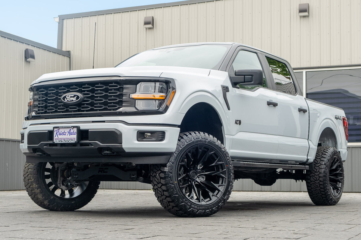 2025 Ford F-150 STX with a 6" Rough Country lift kit, 22x12 Fuel Flame wheels, and 35" Fury Country Hunter R/T tires.