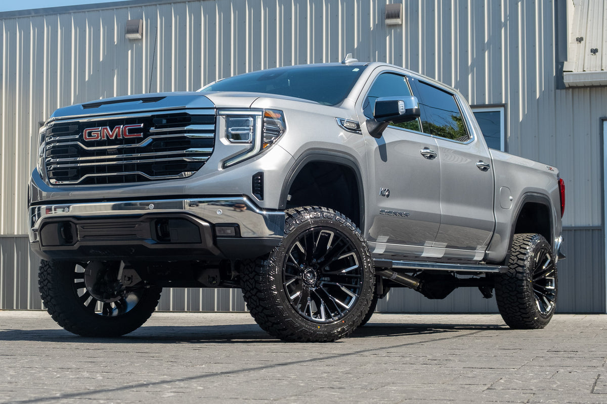 2026 GMC Sierra 1500 SLT with a 6" Rough Country lift kit, 22x12 Fuel Rebar wheels, and 35" Fury Country Hunter R/T tires.