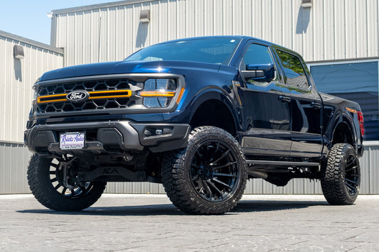 2025 Ford F-150 Tremor with a 6" Rough Country lift kit, 22x12 Fuel Burn wheels, and 35" Fury Country Hunter R/T tires.