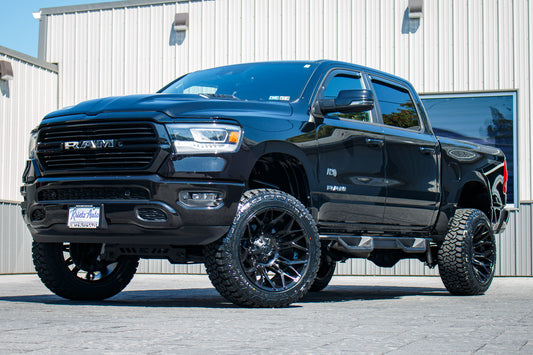 2023 Ram 1500 Laramie with a 6" Rough Country lift kit, 22x12 Fuel Twitch wheels, and 35" Fury Country Hunter R/T tires.