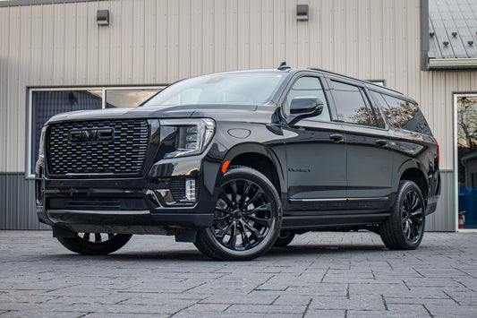 2023 GMC Yukon XL Denali with GMC Factory suspension, 22x9 GMC Stock, and Bridgestone Alenza tires.
