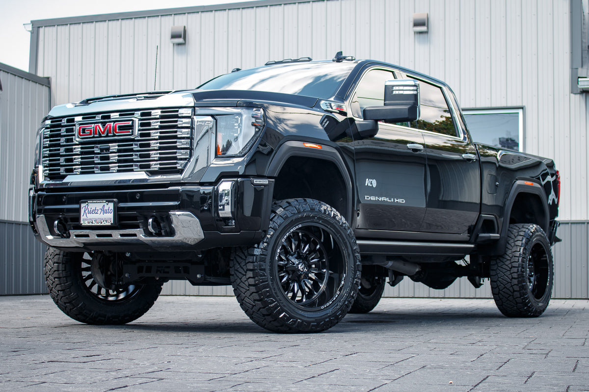 2024 GMC Sierra 2500 HD Denali with a 5" Rough Country lift kit, 22x12 Fuel Arc wheels, and 37" Nitto Ridge Grappler tires.