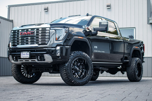 2024 GMC Sierra 2500 HD Denali with a 5" Rough Country lift kit, 22x12 Fuel Arc wheels, and 37" Nitto Ridge Grappler tires.
