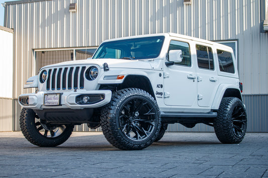 2021 Jeep Wrangler Unlimited Sahara with a 2.5" Rough Country lift kit, 22x12 Fuel Flame wheels, and 35" Fury Country Hunter R/T tires.