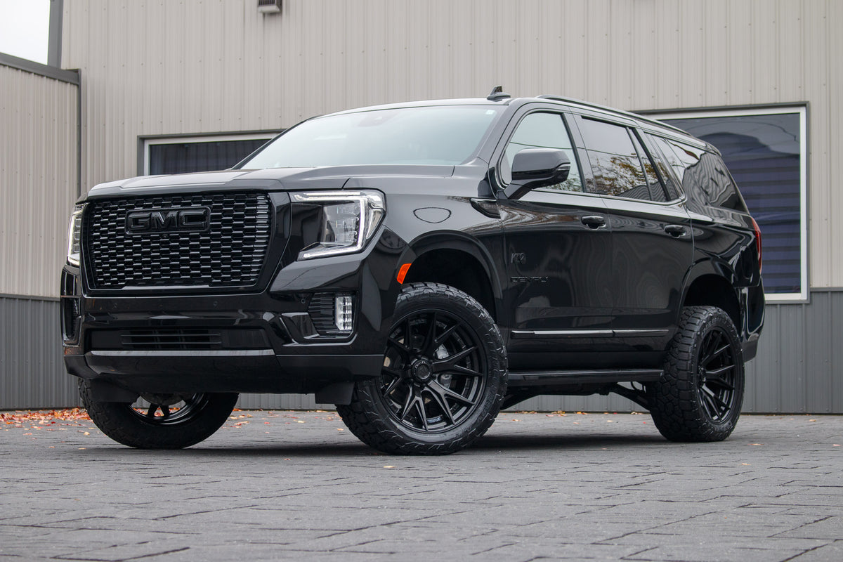 2024 GMC Yukon Denali with a 3" ReadyLift lift kit, 22x10 Fuel Catalyst wheels, and 295/50 Toyo Open Country AT3 tires.