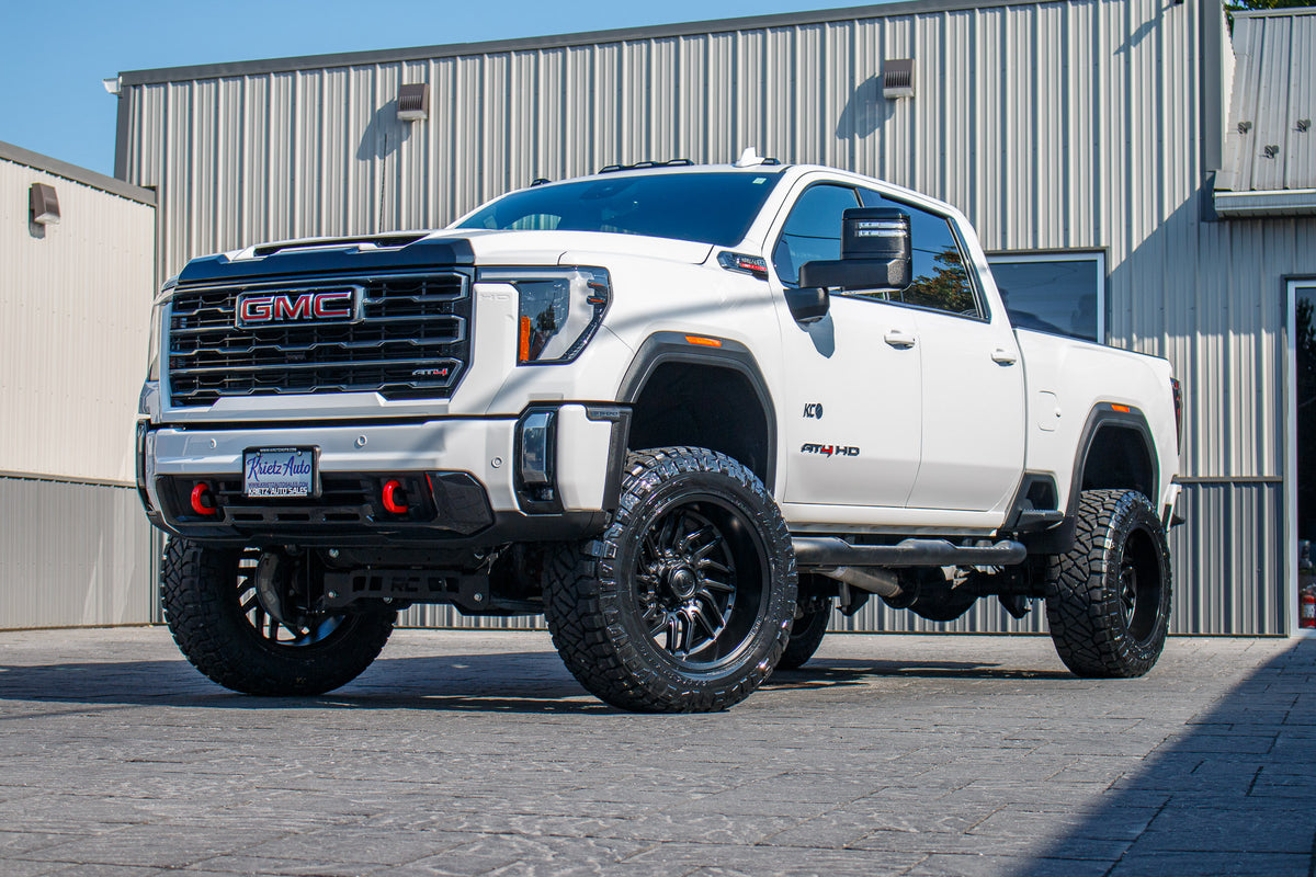 2024 GMC Sierra 3500 AT4 with a 5" Rough Country lift kit, 22x12 Fuel Hurricane wheels, and 37" Nitto Ridge Grappler tires.