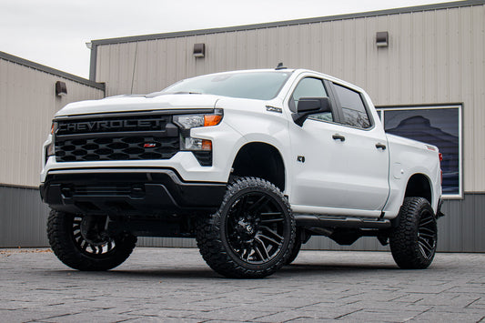 2025 Chevrolet Silverado 1500 Custom Trail Boss with a 6" Rough Country lift kit, 22x12 Fuel Typhoon wheels, and 35" Fury Country Hunter R/T tires.