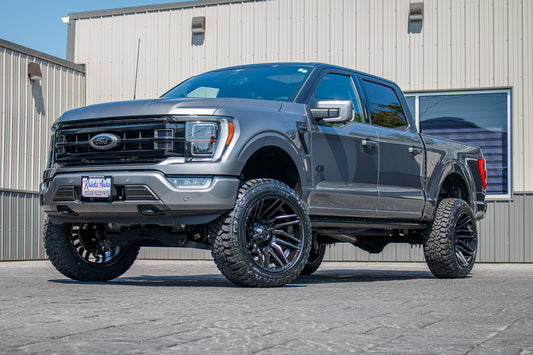 2023 Ford F-150 Lariat with a 6" Rough Country lift kit, 22x12 Fuel Typhoon wheels, and 35" Fury Country Hunter R/T tires.