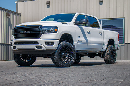 2021 Ram 1500 Big Horn with a 6" Rough Country lift kit, 22x12 Fuel Typhoon wheels, and 35" Fury Country Hunter R/T tires.