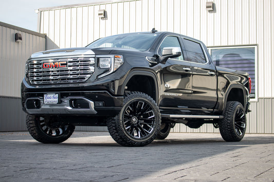 2023 GMC Sierra 1500 Denali with a 6" Rough Country lift kit, 22x12 Fuel Rebar wheels, and 35" Fury Country Hunter R/T tires.