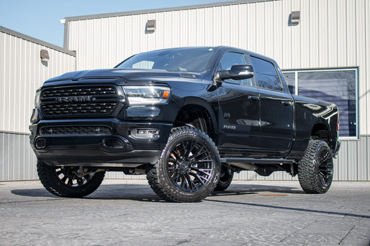 2022 Ram 1500 Big Horn with a 6" Rough Country lift kit, 22x12 Fuel Rebar wheels, and 35" Fury Country Hunter R/T tires.