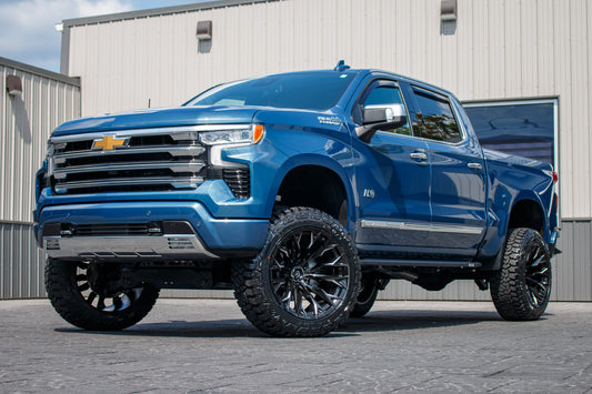 2024 Chevrolet Silverado 1500 High Country with a 6" Rough Country suspension kit, 22x12 Fuel Flame wheels, and 35" Fury Country Hunter R/T tires.