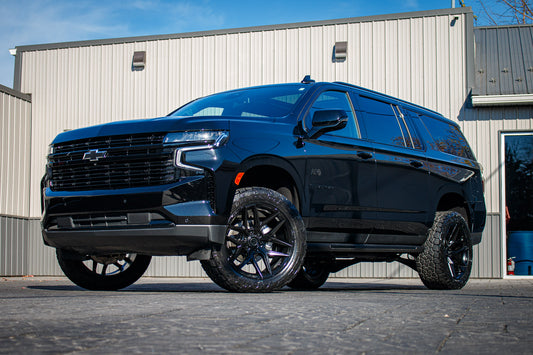 2023 Chevrolet Suburban RST with a 3" ReadyLift lift kit, 22x10 Fuel Flux wheels, and 295/50 Toyo Open Country AT3 tires.