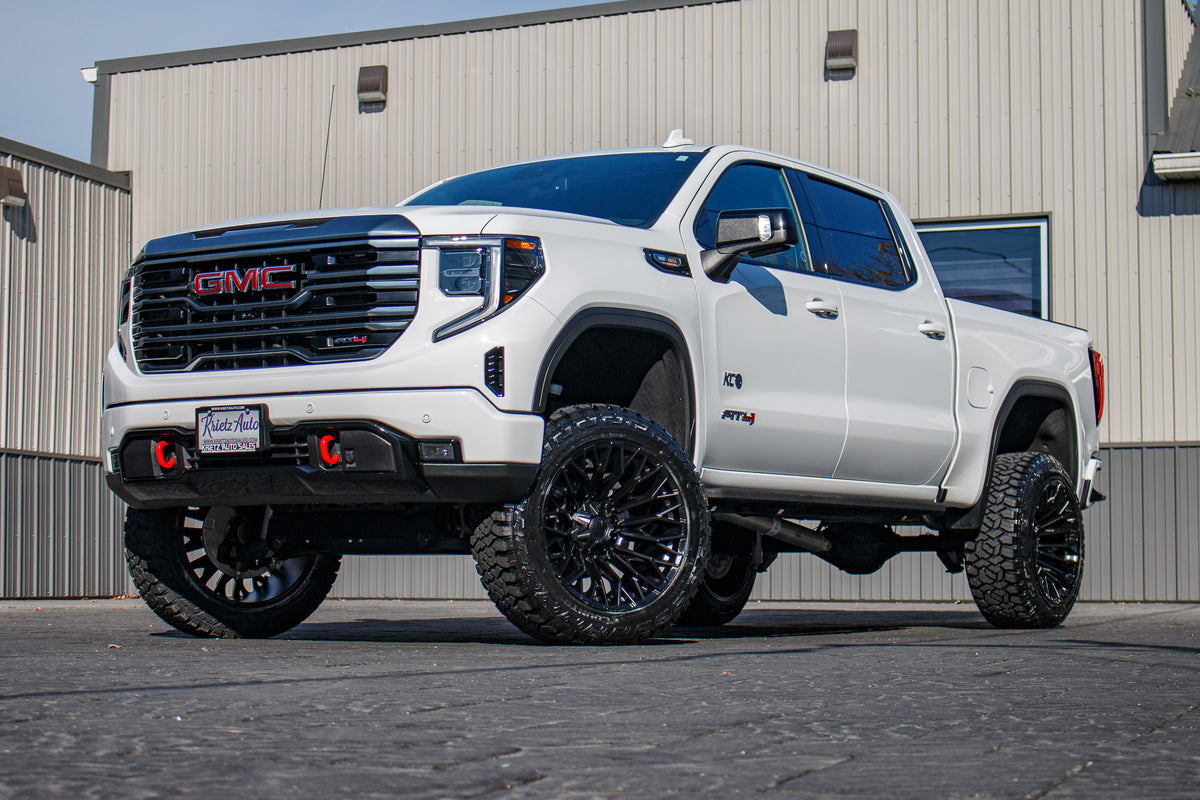 2024 GMC Sierra 1500 AT4 with a 6" Rough Country lift kit, 22x12 Fuel Strike wheels, and 35" Fury Country Hunter R/T tires.