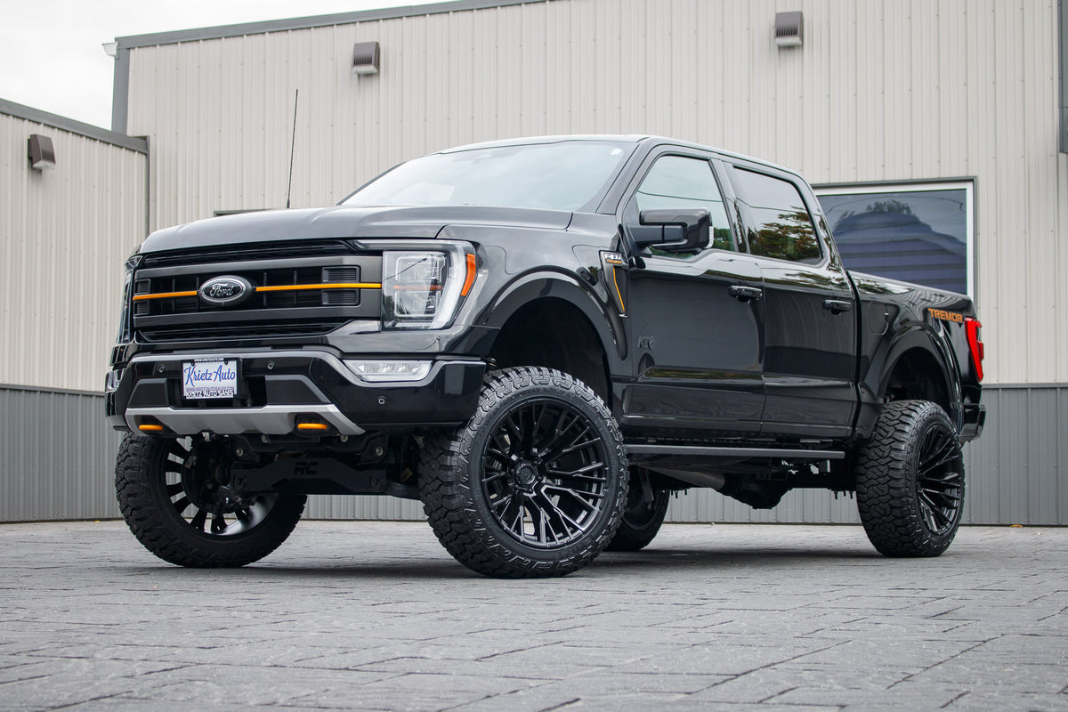 2023 Ford F-150 Tremor with a 6" Rough Country lift kit, 22x12 Fuel Rebar wheels, and 35" Fury Country Hunter R/T tires.