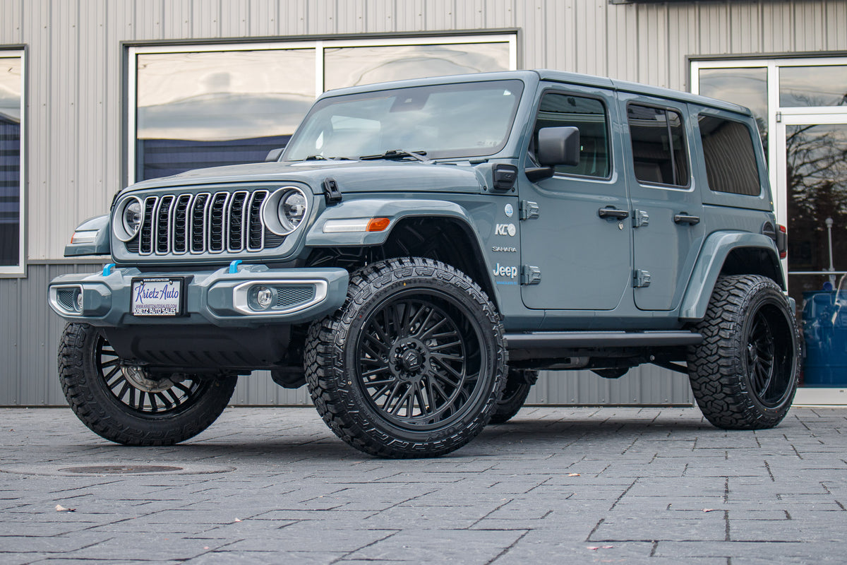 2024 Jeep Wrangler Unlimited Sahara 4XE with a 2.5" Rough Country lift kit, 22x12 TIS 553B wheels, and 35" Fury Country Hunter R/T tires.