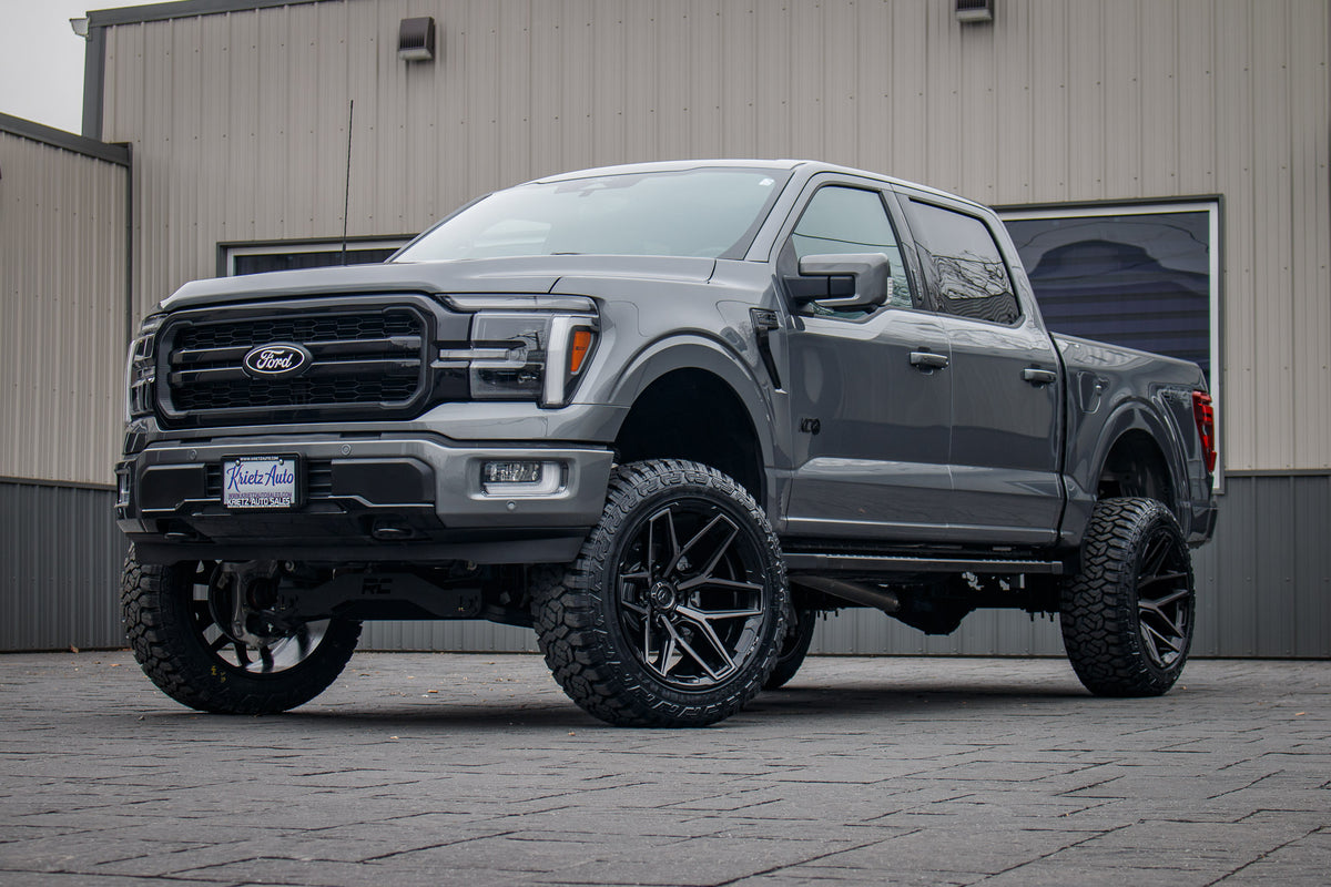 2024 Ford F-150 Lariat with a 6" Rough Country lift kit, 22x12 Fuel Flux wheels, and 35" Fury Country Hunter R/T tires.