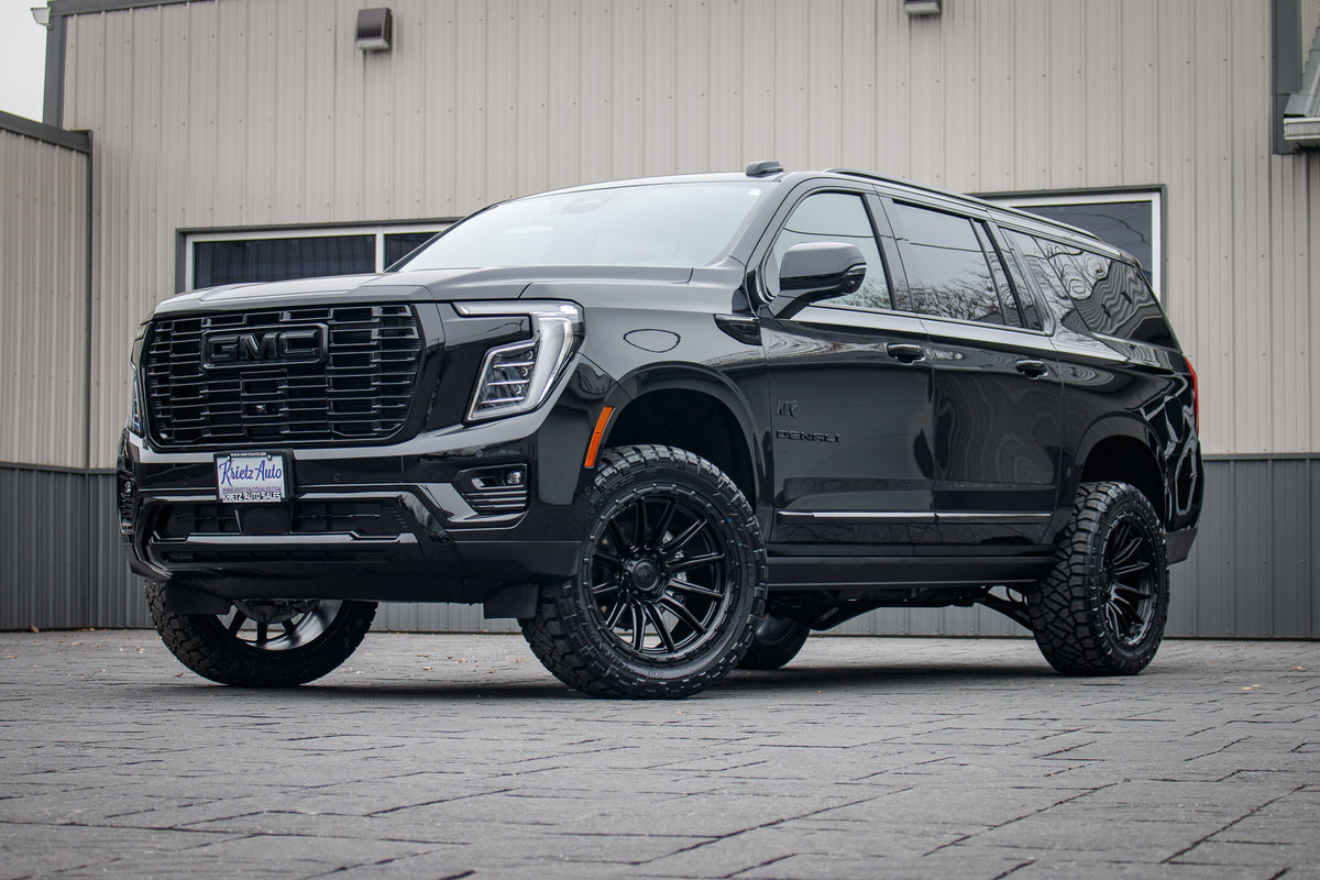 2025 GMC Yukon XL Denali with a 3" ReadyLift lift kit, 22x10 Fuel Piston wheels, and 295/50 Nitto Ridge Grappler tires.