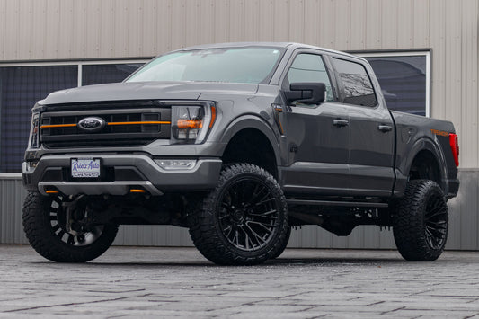 2023 Ford F-150 Tremor with a 6" Rough Country lift kit, 22x12 Fuel Rebar wheels, and 35" Fury Country Hunter R/T tires.