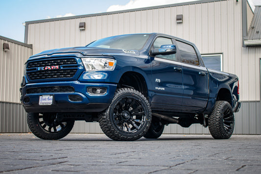 2023 Ram 1500 Big Horn with a 6" Rough Country lift kit, 22x12 Fuel Blitz wheels, and 35" Fury Country Hunter R/T tires.