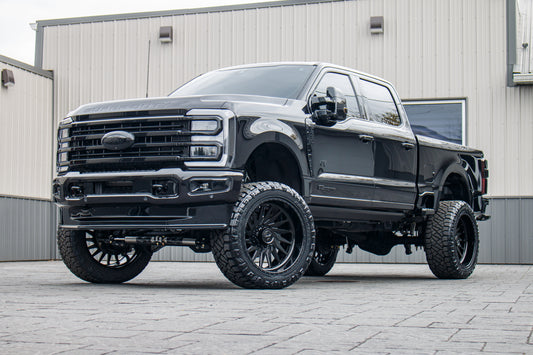 2023 Ford F-250 Super Duty Limited with a 6" Wicked lift kit, 24x12 American Force Morph wheels, and 37" Nitto Ridge Grappler tires.