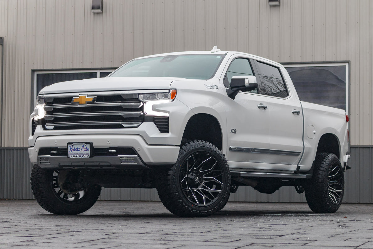 2024 Chevrolet Silverado 1500 High Country with a 6" Rough Country lift kit, 22x12 Fuel Twitch wheels, and 35" Fury Country Hunter R/T tires.