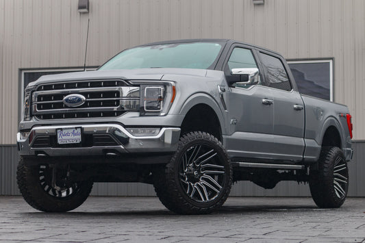 2023 Ford F-150 Lariat with a 6" Rough Country lift kit, 22x12 Fuel Typhoon wheels, and 35" Fury Country Hunter R/T tires.