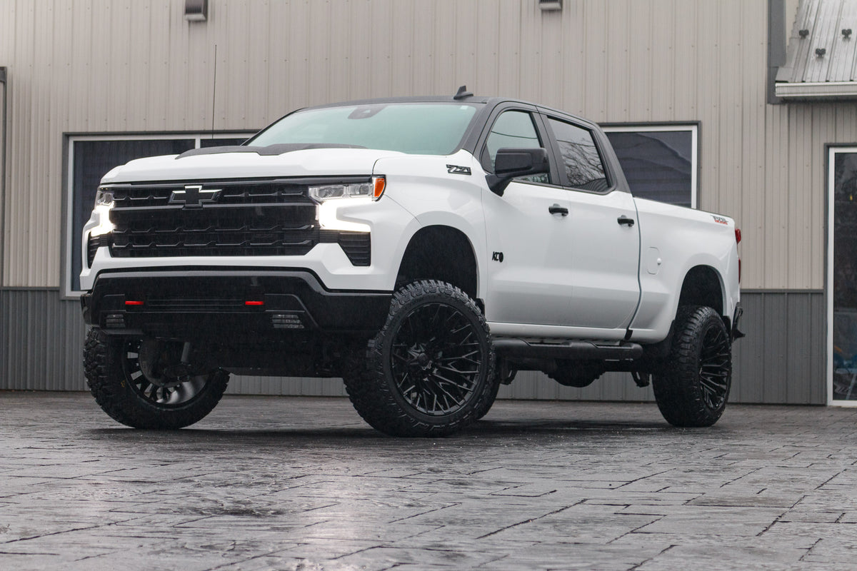 2024 Chevrolet Silverado 1500 LT Trail Boss with a 6" Rough Country lift kit, 22x12 Fuel Strike wheels, and 35" Fury Country Hunter R/T tires.