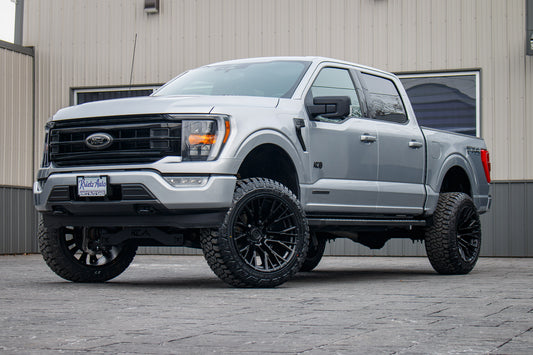 2022 Ford F-150 XLT with a 6" Rough Country lift kit, 22x12 Fuel Rebar wheels, and 35" Fury Country Hunter R/T tires.