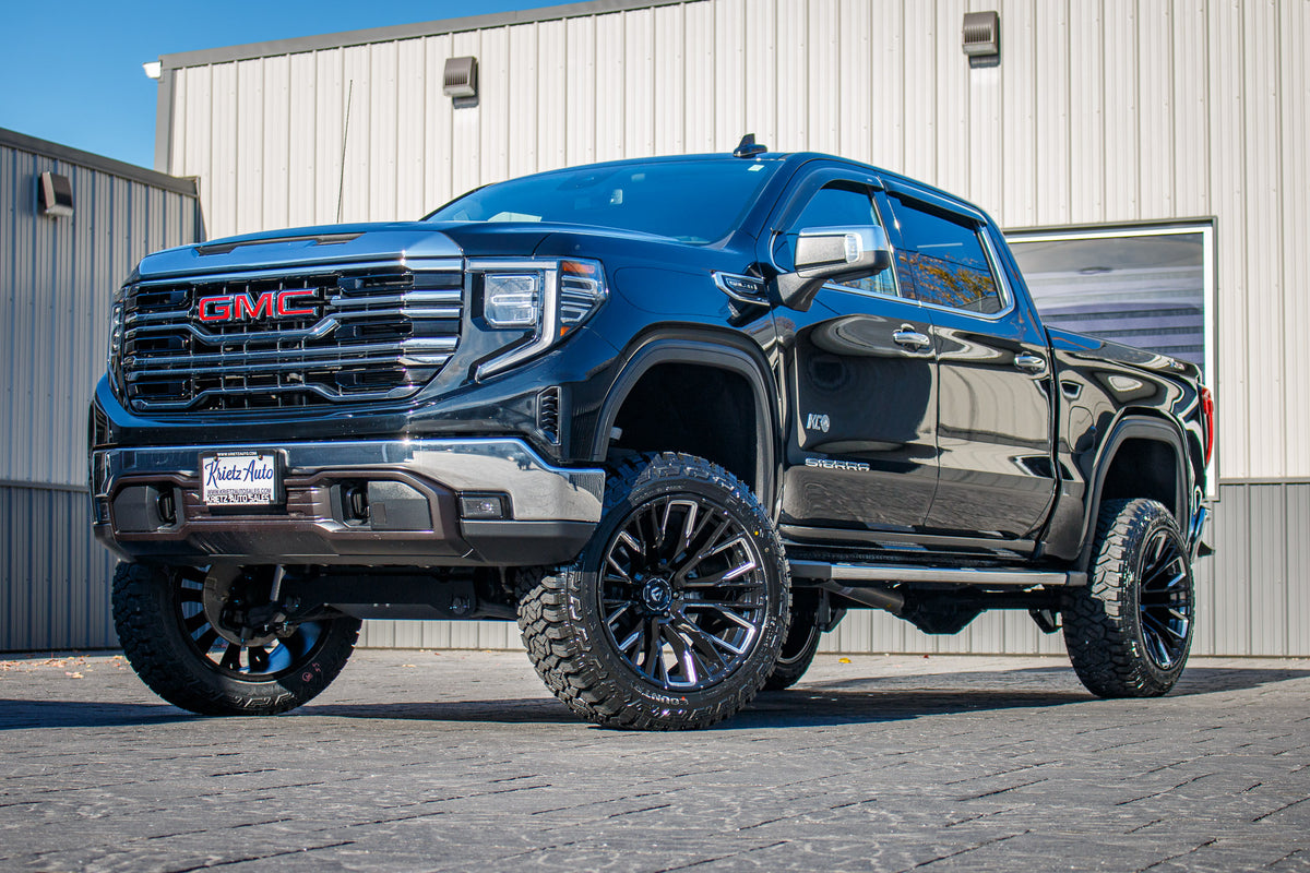 2023 GMC Sierra 150 SLT with a 6" Rough Country lift kit, 22x12 Fuel Rebar wheels, and 35" Fury Country Hunter R/T tires.