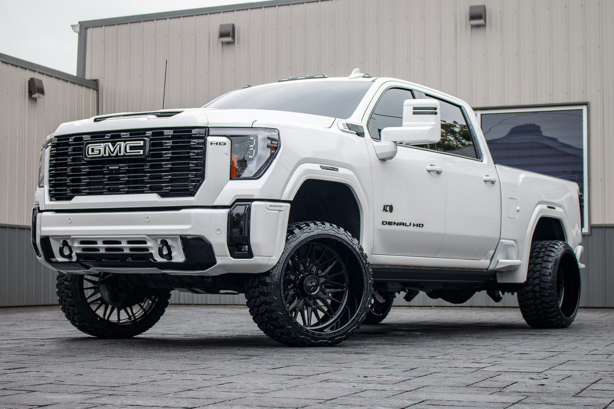 2024 GMC Sierra 2500 Denali with a 3" Cognito leveling kit, 24x14 American Force Frost wheels, and 33" Fury Country Hunter M/T tires.