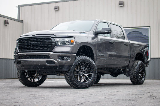 2023 Ram 1500 Lone Star with a 6" Rough Country lift kit, 22x12 Fuel Flux wheels, and 35" Fury Country Hunter R/T tires.